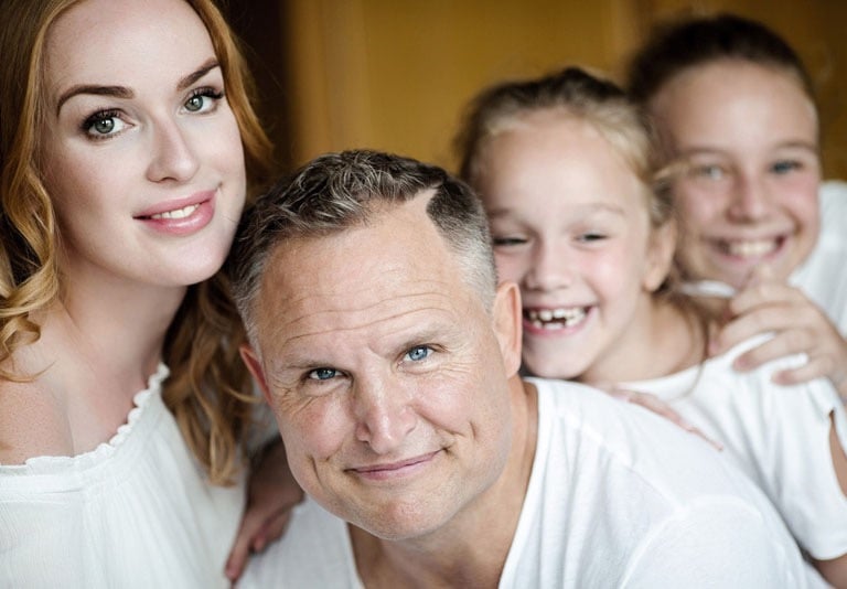 a man and two children posing for a family photoshooting