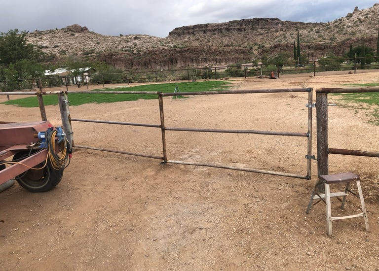 gated metal fence that Prescott Welding Company built