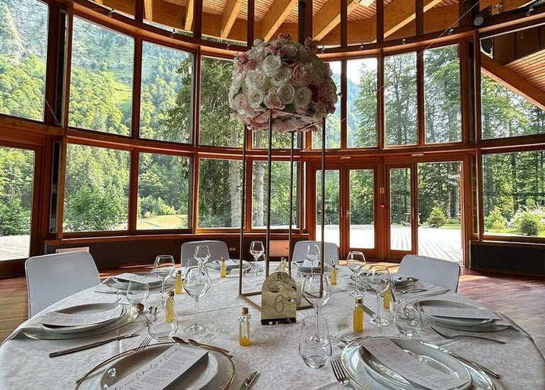 A wedding table set with flowers in the middle