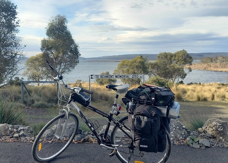a bikepacking bicycle at a rest stop next to a Tasmanian beach