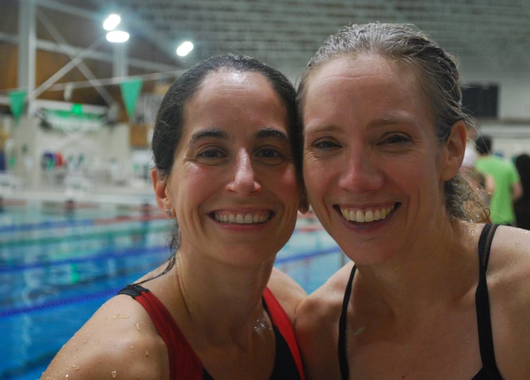 two swimmers smiling