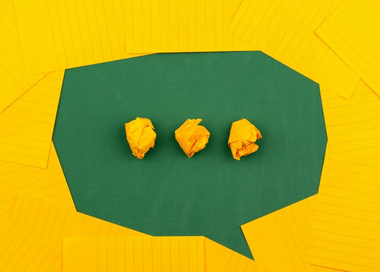 green text bubble on a yellow card background