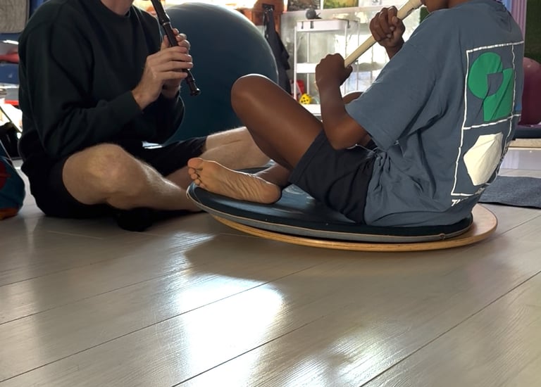 music teach and child on recorder