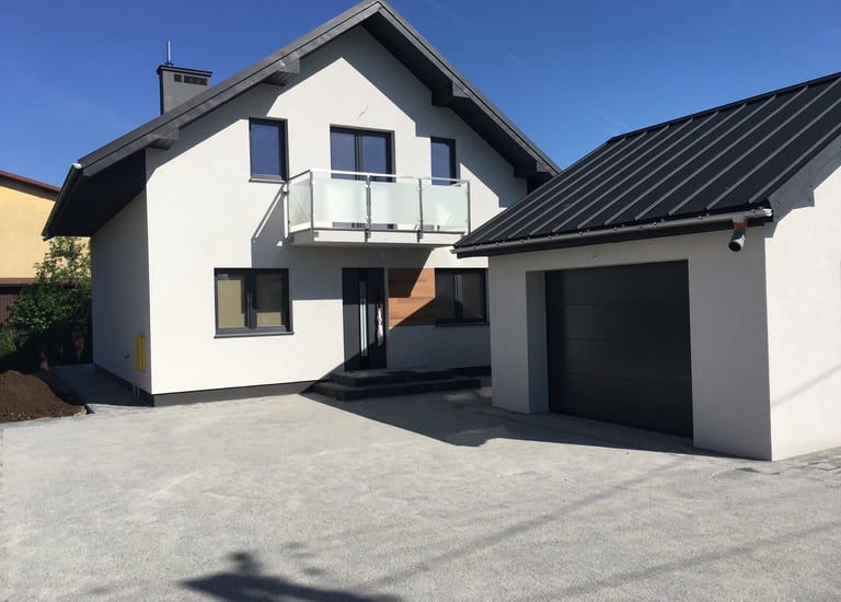 a house with a garage door and a garage door