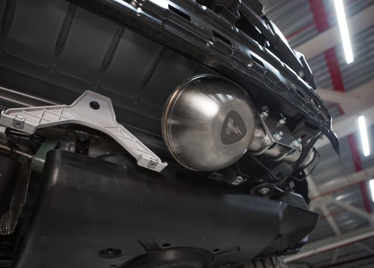 an Enlab Mercedes engine with a chromed headlight on it