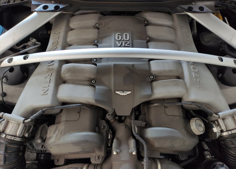 an Enlab car engine with a number of engine parts on it