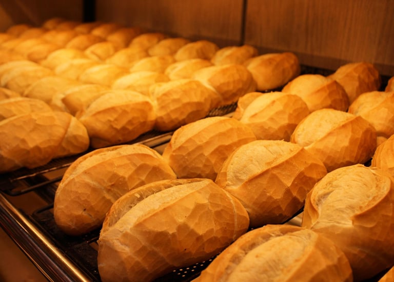 a bunch of breaded breaded breads on a rack