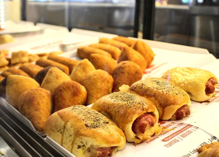 a tray of food that includes sausages and sausages