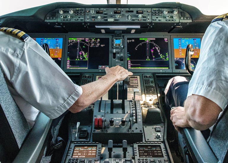 two pilots in a cockpit of a plane