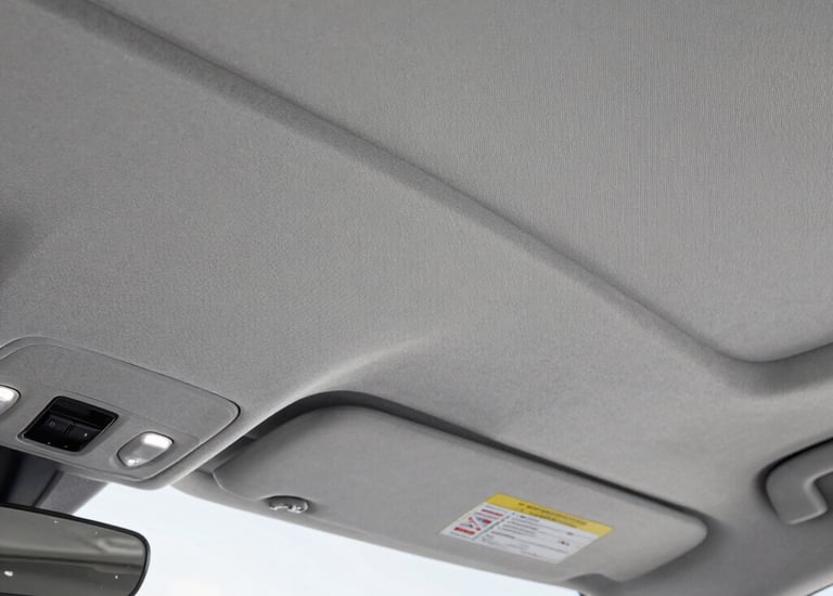 Smooth tan leather car seat with precise stitching