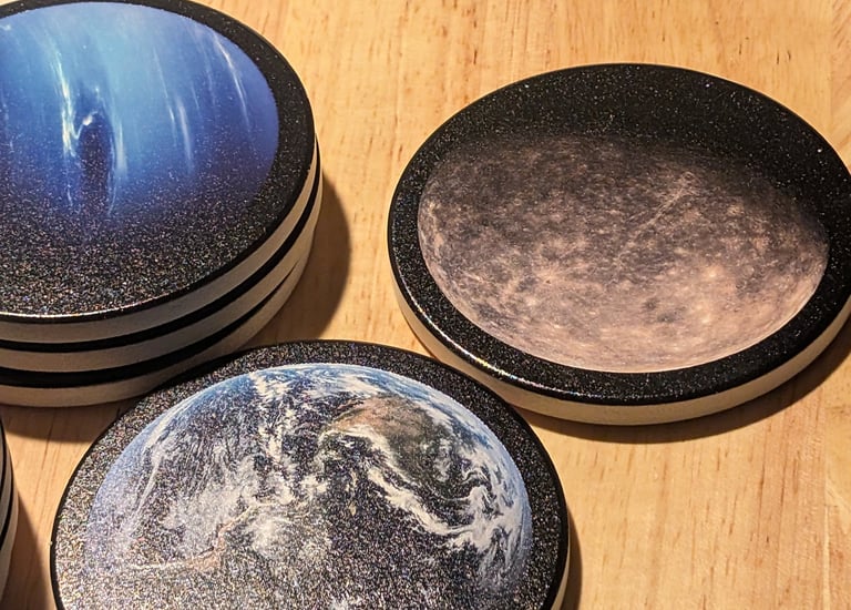 Set of custom coasters featuring planets.