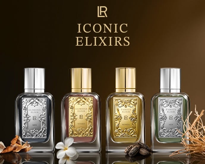 Luxury Iconic Elixirs perfume collection featuring gold and silver glass bottles for men and women.