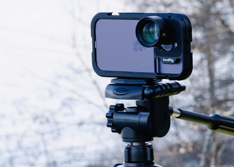 Mobile filmaking gear with an iPhone, a gimbal, and clip on lense