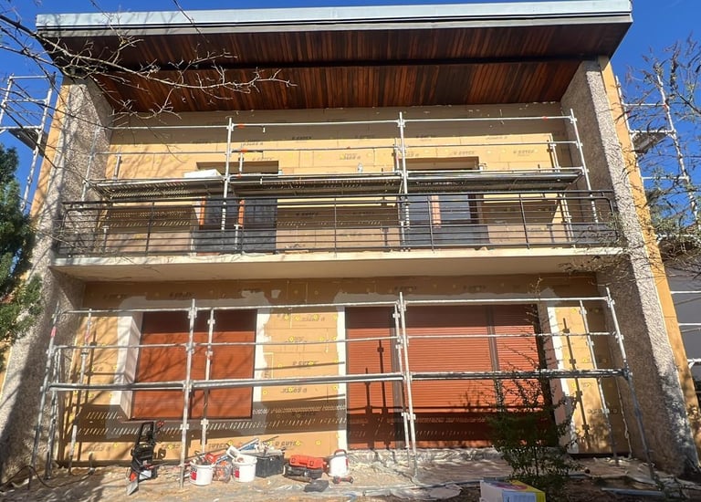 a house with a balcony and a balcony with a balcony