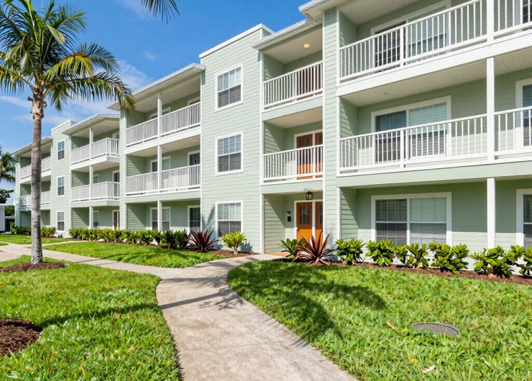 Shared building exterior showing well-maintained common areas and clean walkways.