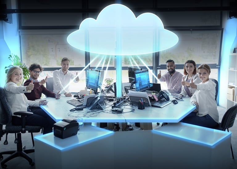 Six adults gesturing thumbs up while sitting around computer displays with a graphic of a cloud above their heads.