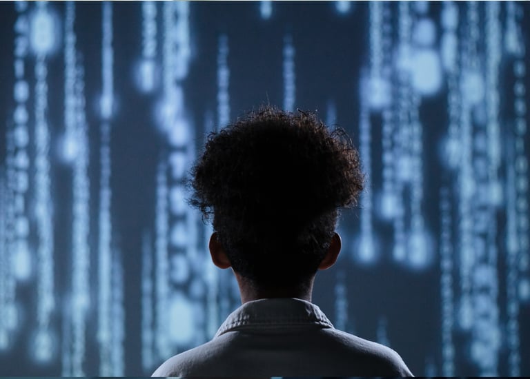 A software developer views falling digital code and binary data on a large screen.