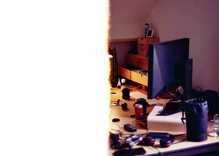 Bogdan Dobrin workspace desk with 35mm film burn. Unedited SOOC photography process.
