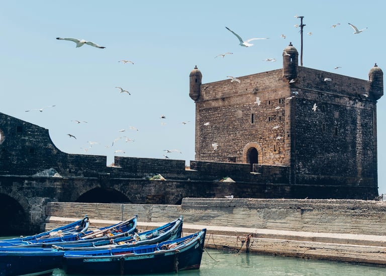 Essaouira ramparts and fishing boats during 4-day coastal heritage tour