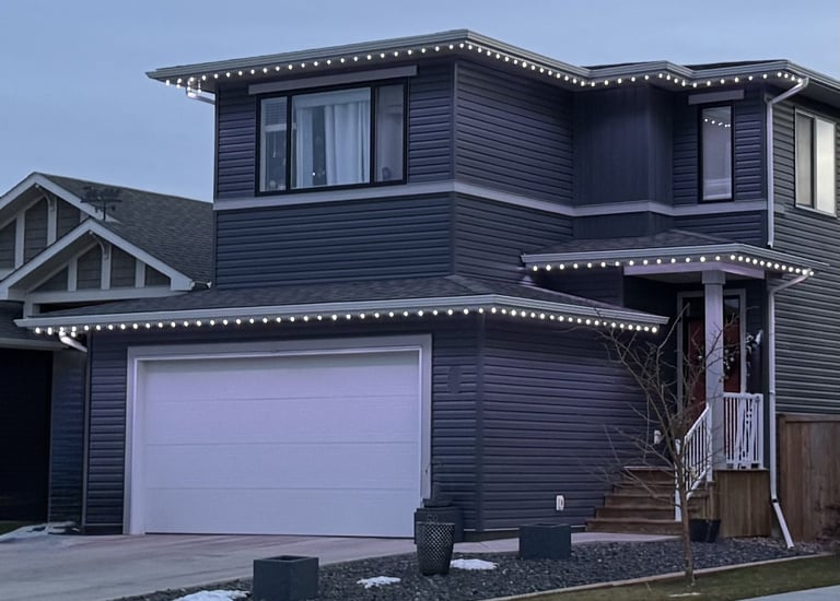 Beautiful permanent holiday lighting installed by MY-LITES certified dealers on a home exterior. 