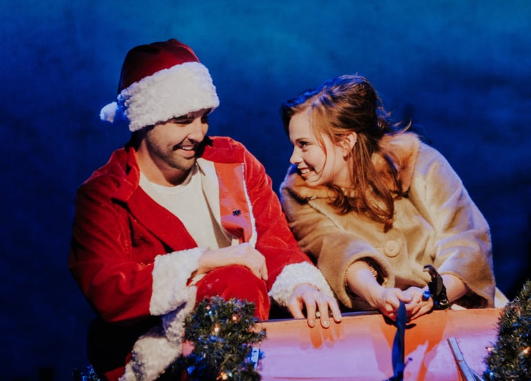 a man and woman in santa claus costume