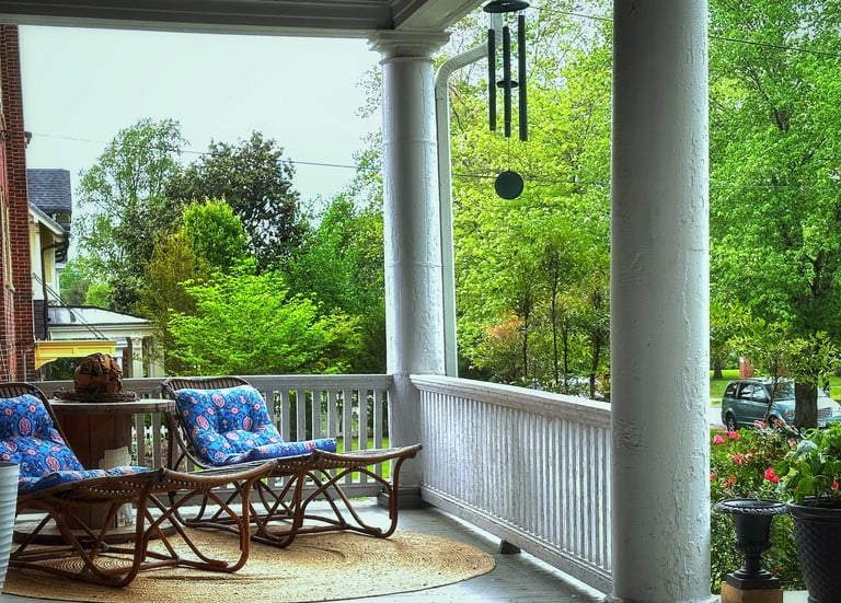 front porch with loungers and wind chimes 2123 Rivermont