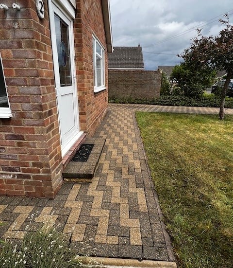 “Professional PJB Exterior Cleaning technician carefully cleaning block paving in Norwich, Norfolk,