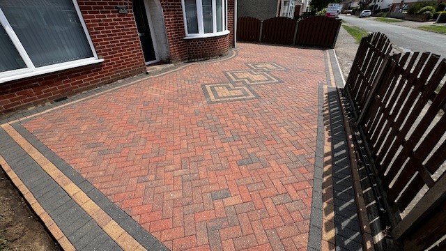 Safe and effective pressure washing of brick weave driveway by PJB Exterior Cleaning in Norwich Norf