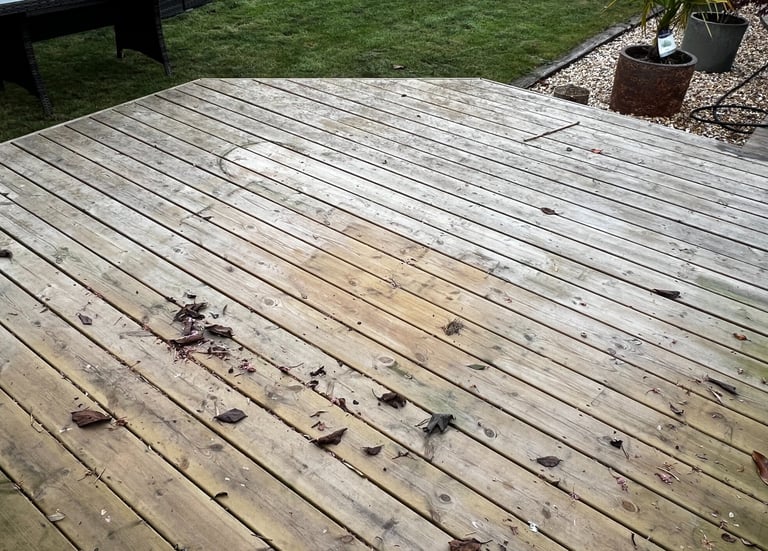 Timber decking professionally cleaned and restored by PJB Exterior Cleaning, showing a fresh and rev