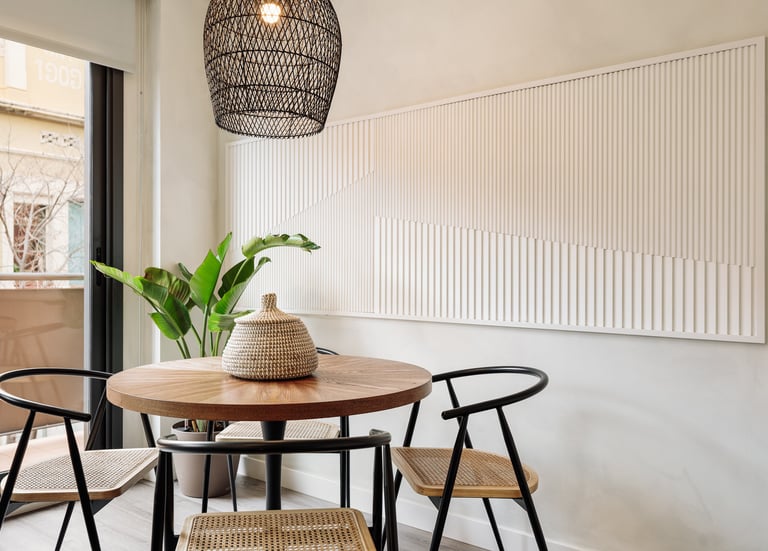 Elegant dining area with bespoke relief wall panels and contemporary furniture and sleek design