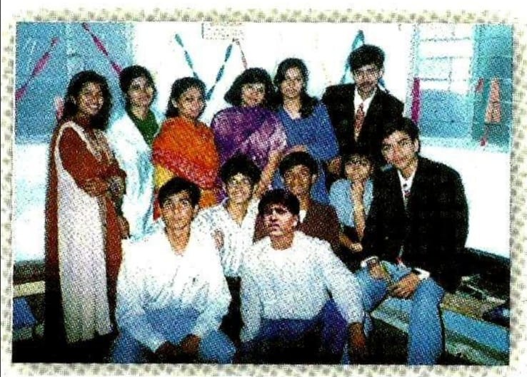 a group of people posing for a photo
