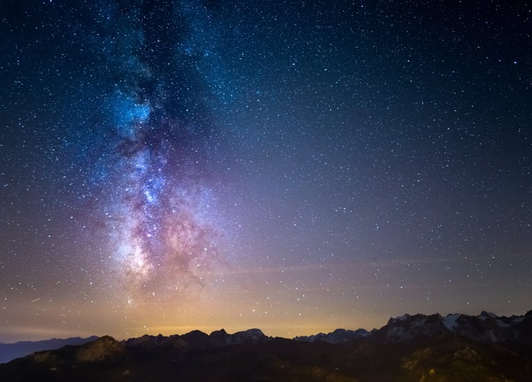Milky Way galaxy over snowy mountains