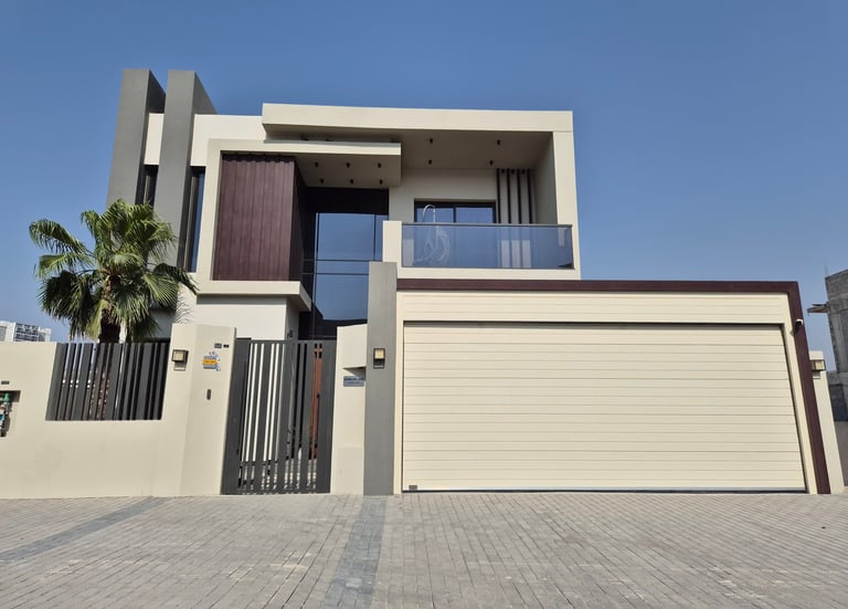 Automatic sectional overhead garage door for modern residential villa in Dubai.
