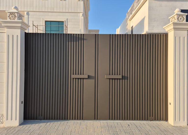 Automatic cast aluminum sliding gate with ornate decorative design for Dubai villa.