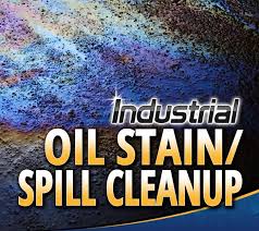 a man cleaning a dirty oil spill canister a pot of oil