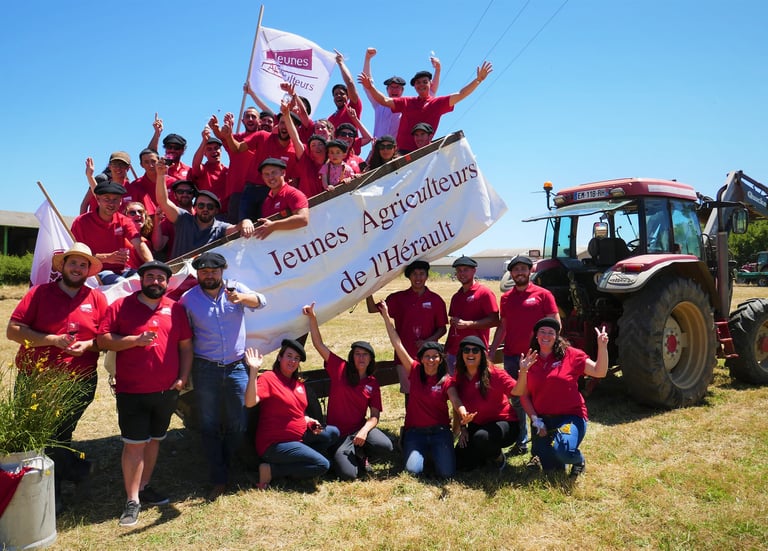 a group of people standing around a large banner