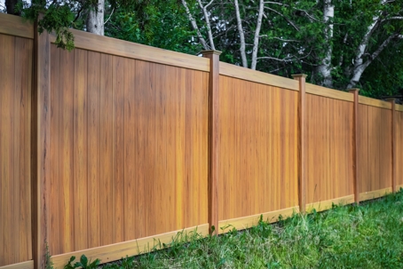 Seamless horizontal wood privacy fence installation with solid post construction.