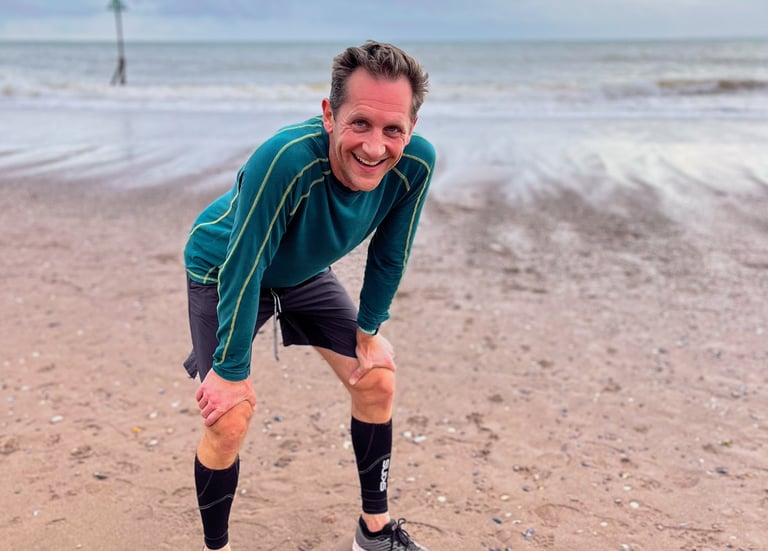 Marcus grinning after finishing run on beach