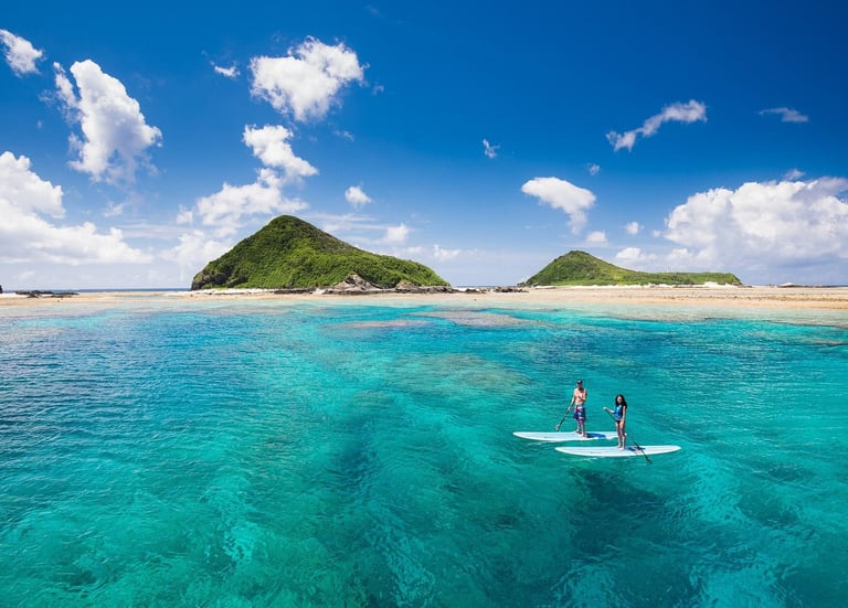 surfing in okinawa- picture of a couple surfing outside of okinawa island