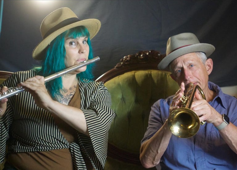 Two band members play music together