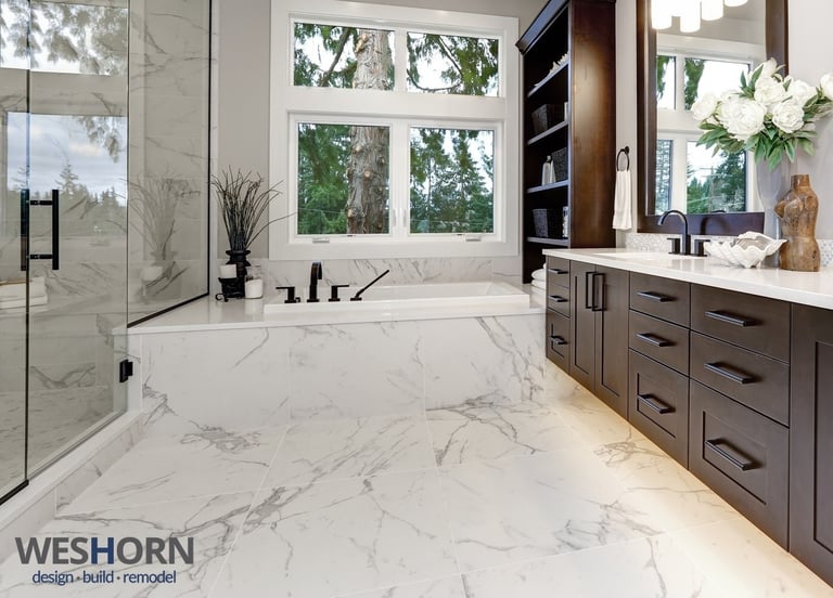 Modern bathroom with walk‑in glass shower, large vanity, and contemporary tile design