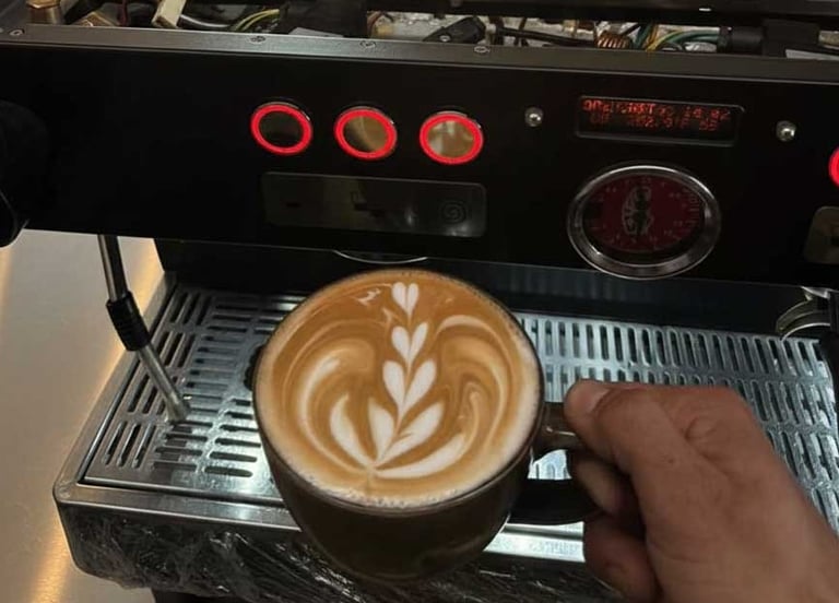 Specialized technician performing internal maintenance on a commercial espresso machine in a local c