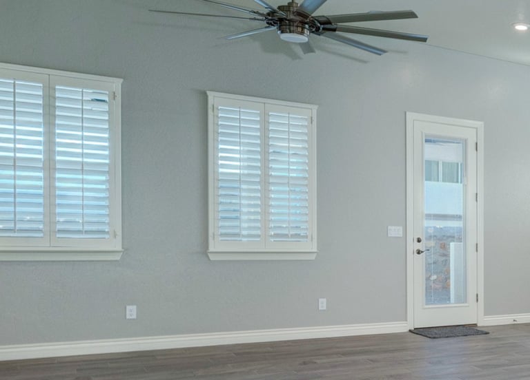 white shutters blue kitchen open space