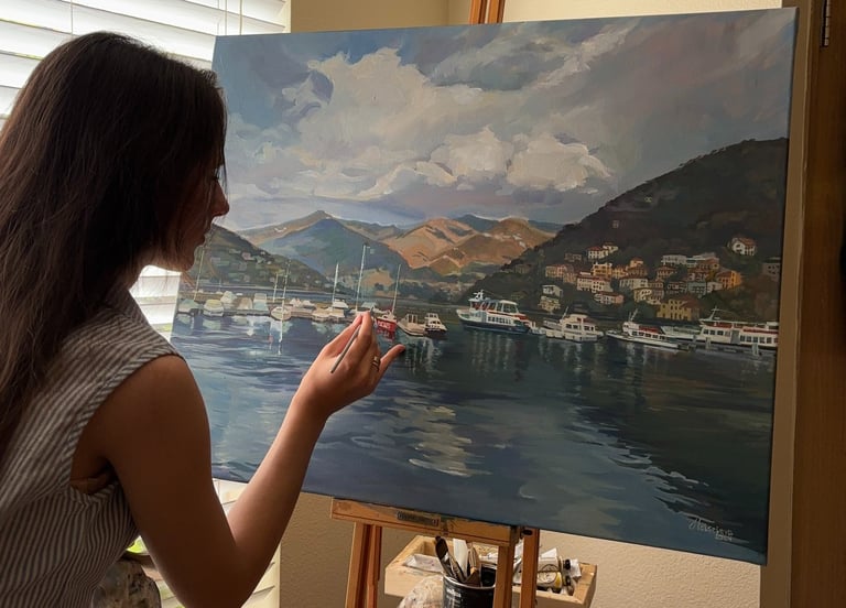 Angela Moiseieva at work on 'Whispers of Como' 24x30 inches Serene Harbor oil painting