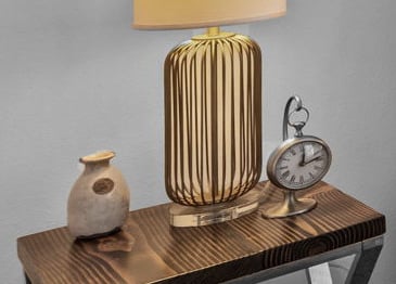 a lamp that is sitting on a table with accents