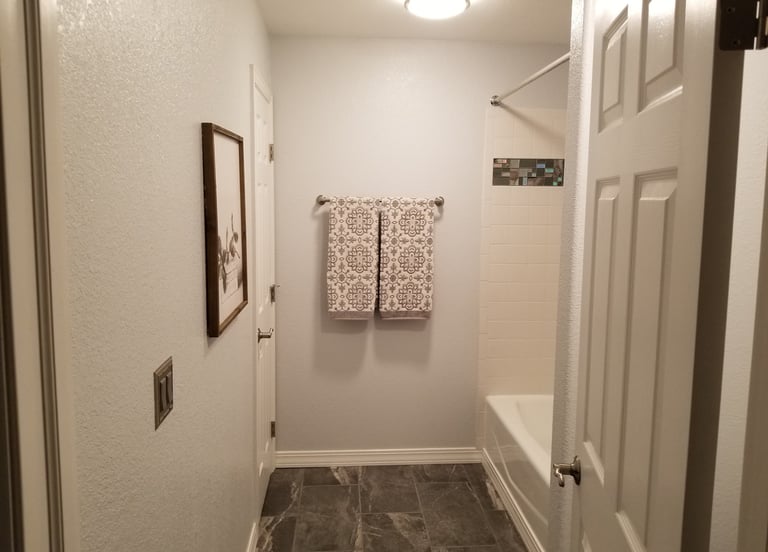a bathroom with a shower and a shower