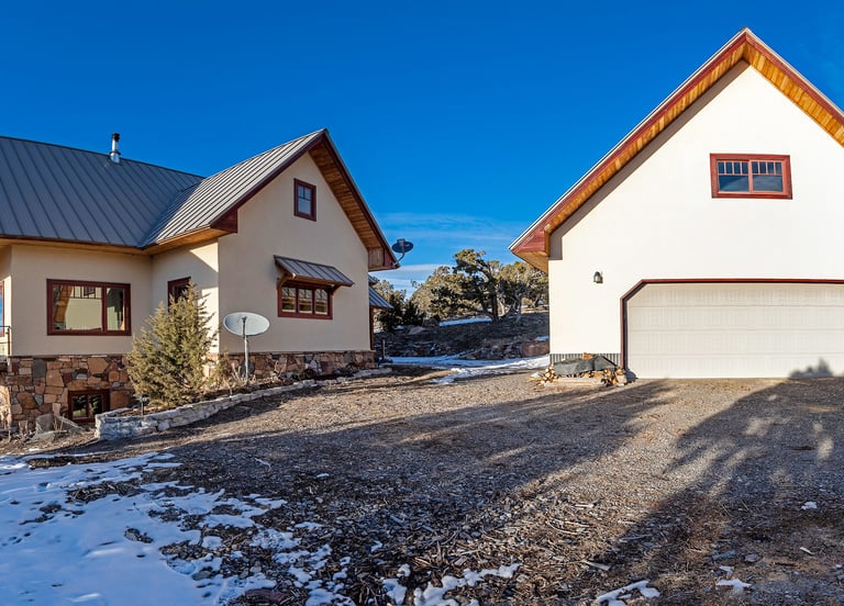 a house with a garage door and a garage door