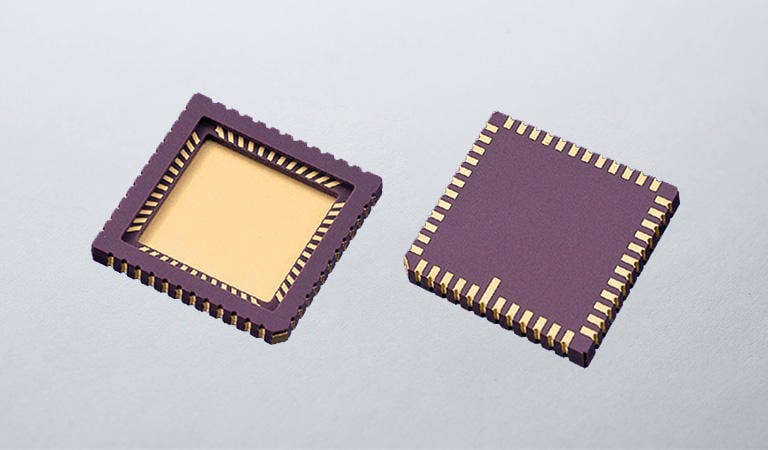 a couple of microchips sitting on top of a table
