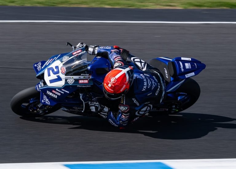 a person riding a motorcycle on a track