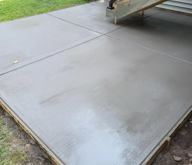 Broom-finish concrete detail with control joints.